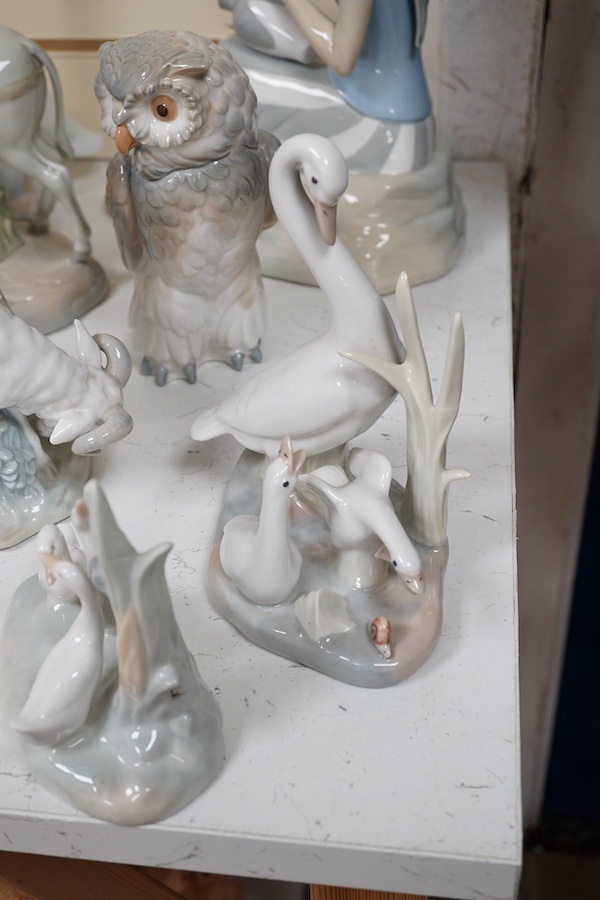 A quantity of Lladro style and Nao figures (12). Condition - good